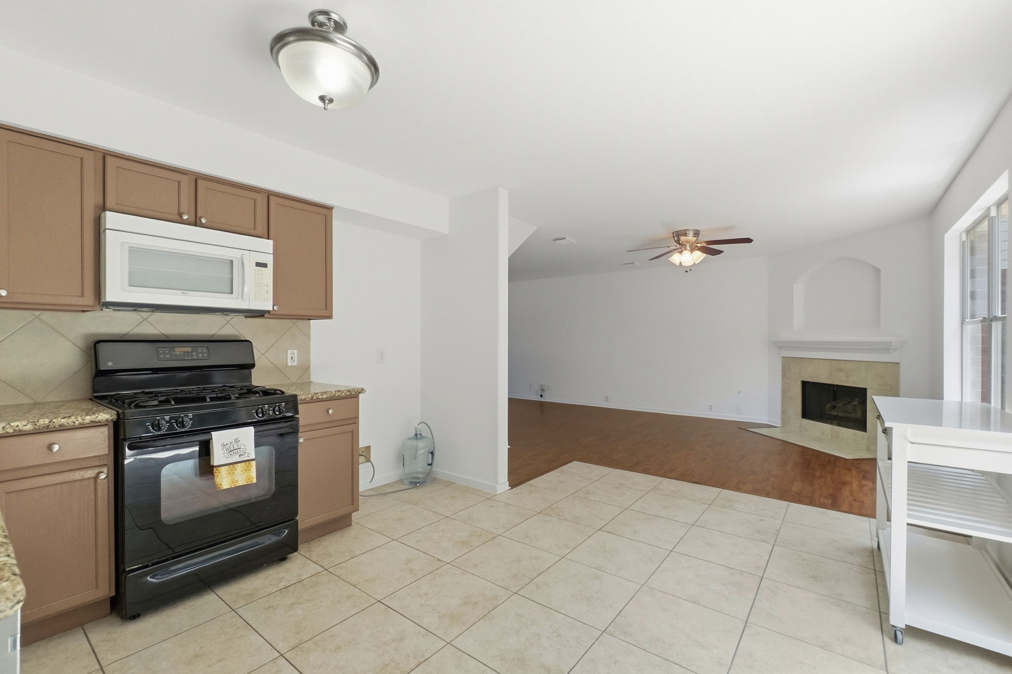 11907 Ezekiel Road Tomball, TX 77375 - Photo 15 of 39 a kitchen with granite countertop a stove and a sink