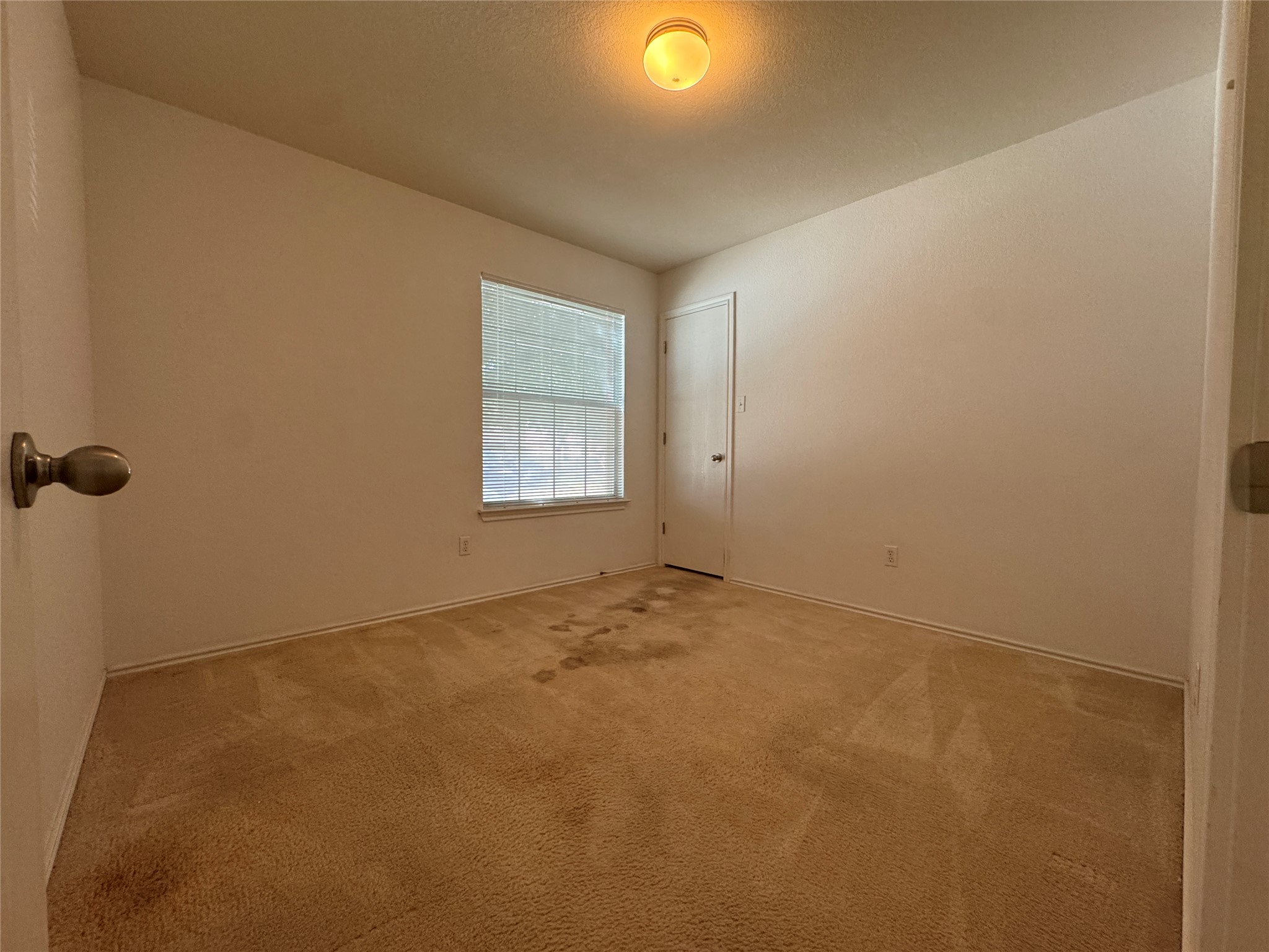 18420 Wind Tree Lane Elgin, TX 78621 - Photo 9 of 15 an empty room with a empty space and a window