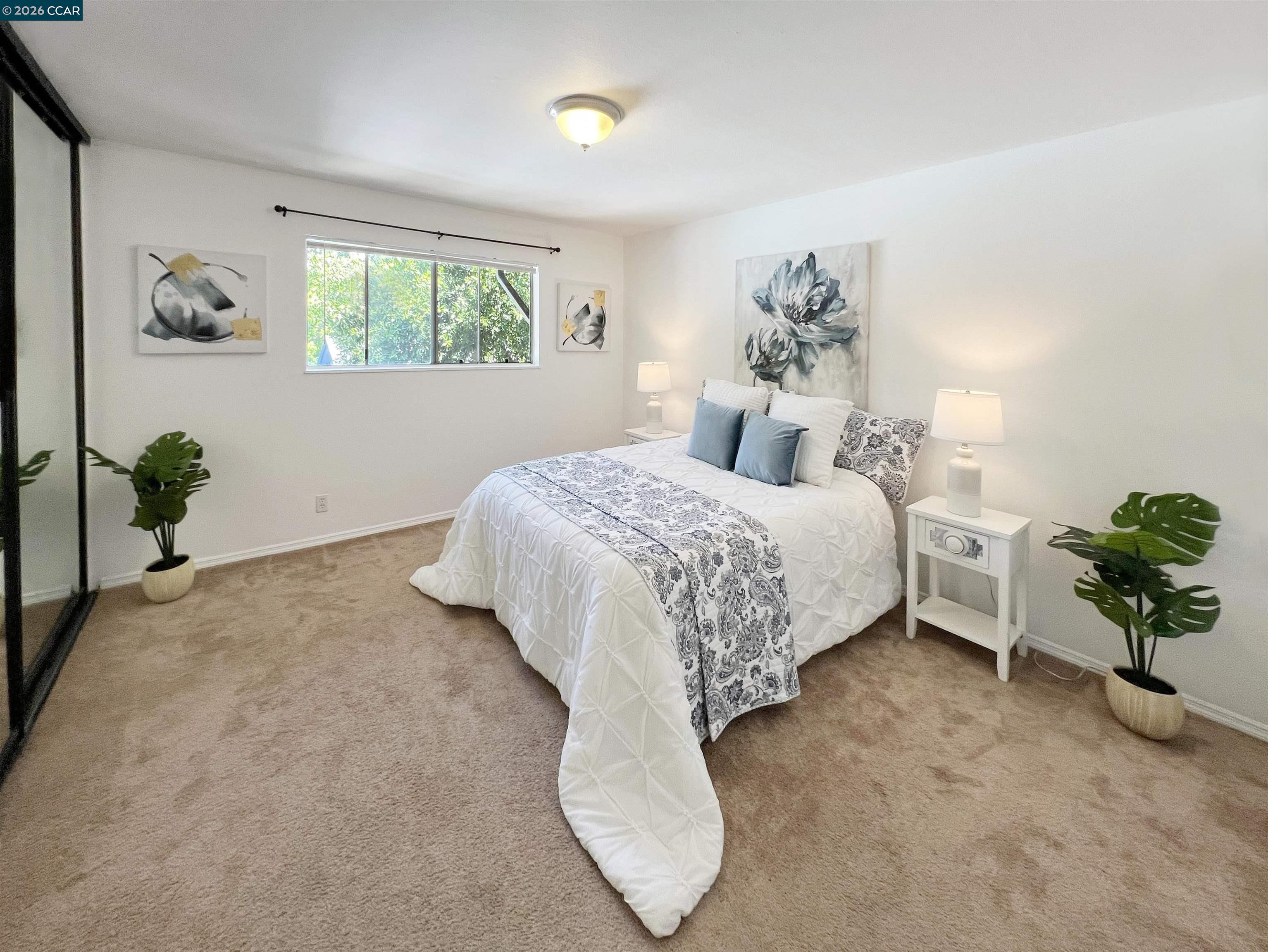 9085 Alcosta Boulevard, Unit 424 San Ramon, CA 94583 - Photo 7 of 21 a bedroom with a bed potted plant and a window