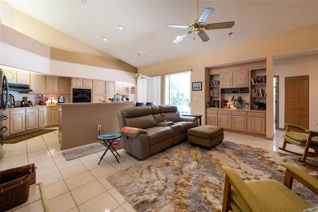 a kitchen with stainless steel appliances a refrigerator sink and cabinets