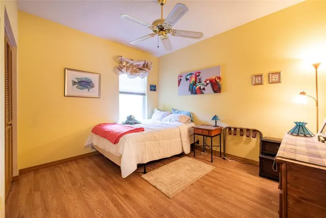 a bathroom with a double vanity sink a mirror and a bathtub