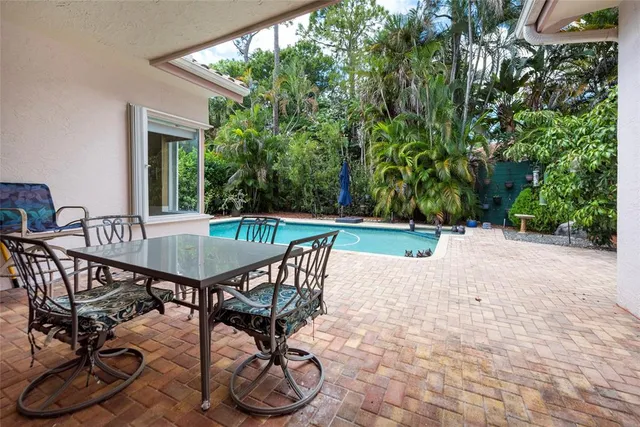a front view of house with a garden and patio