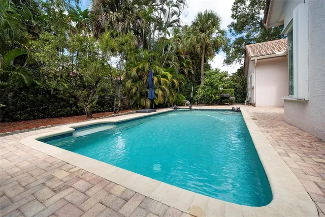 a view of a backyard with sitting area