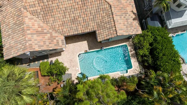 an aerial view of a house with outdoor space
