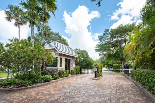a view of a house with a yard and a garden