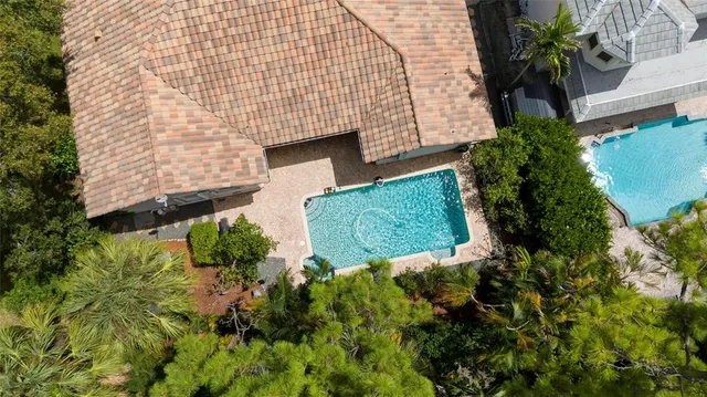 an aerial view of multiple house with a yard