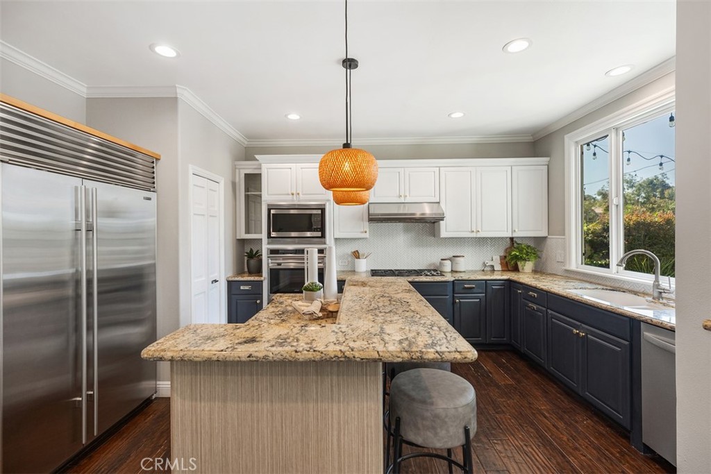 6 Calella Laguna Niguel, CA 92677 - Photo 11 of 28 a kitchen with stainless steel appliances granite countertop a sink stove and refrigerator