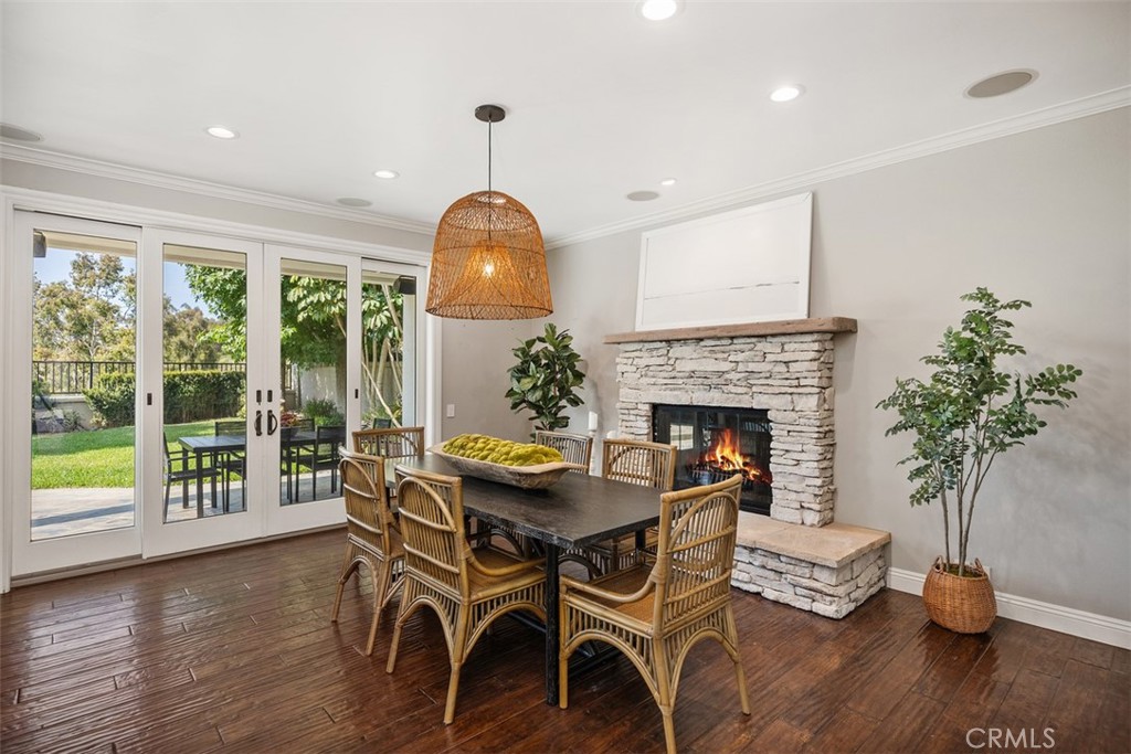 6 Calella Laguna Niguel, CA 92677 - Photo 8 of 28 a view of a livingroom with furniture a fireplace and wooden floor