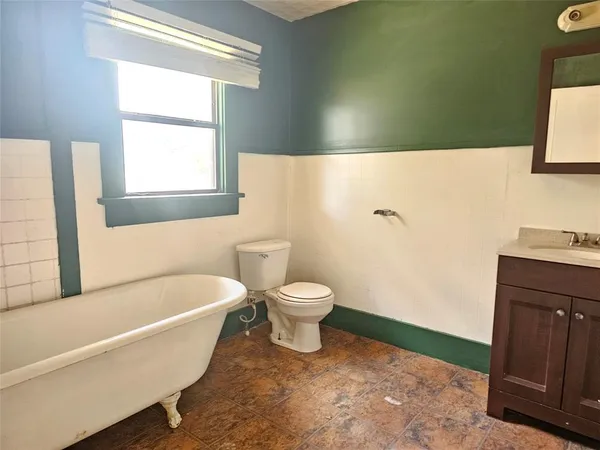 a bathroom with a toilet a sink and a bathtub