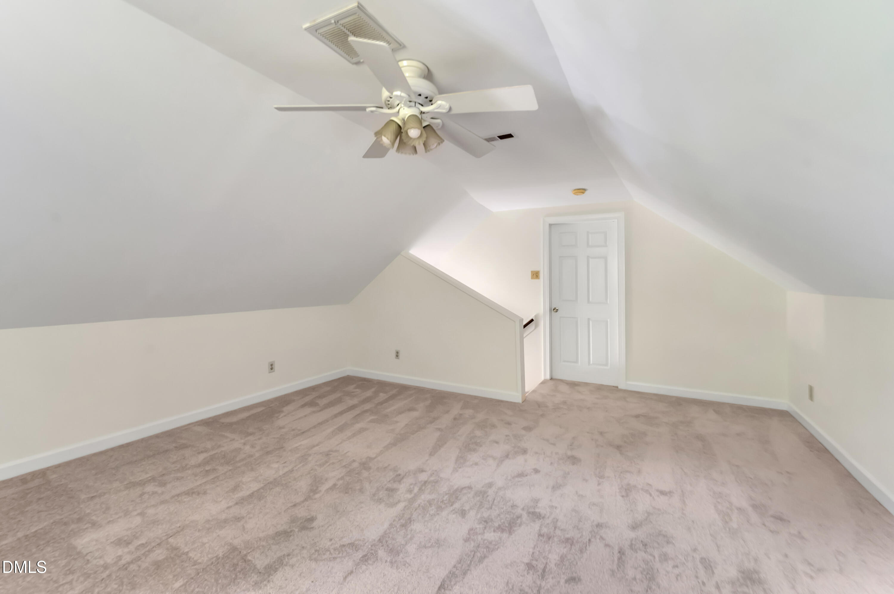 7500 Drayton Court Raleigh, NC 27615 - Photo 20 of 27 an empty room with a chandelier fan and windows