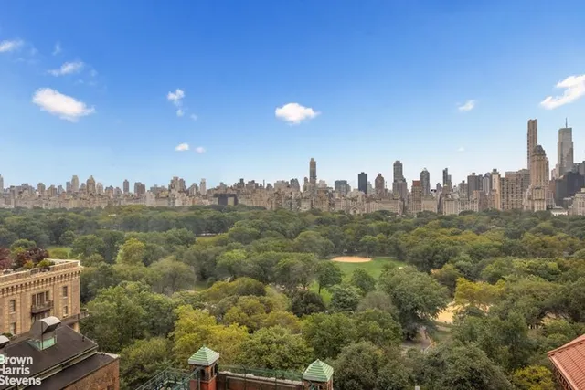 a large white bathroom with a sink a toilet and shower