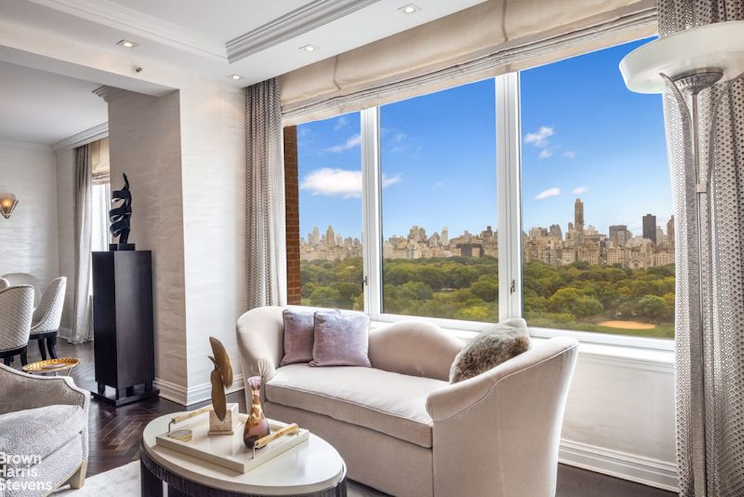 15 West 63rd Street, Unit 20B Manhattan, NY 10023 - Photo 4 of 14 a living room with furniture and a large window