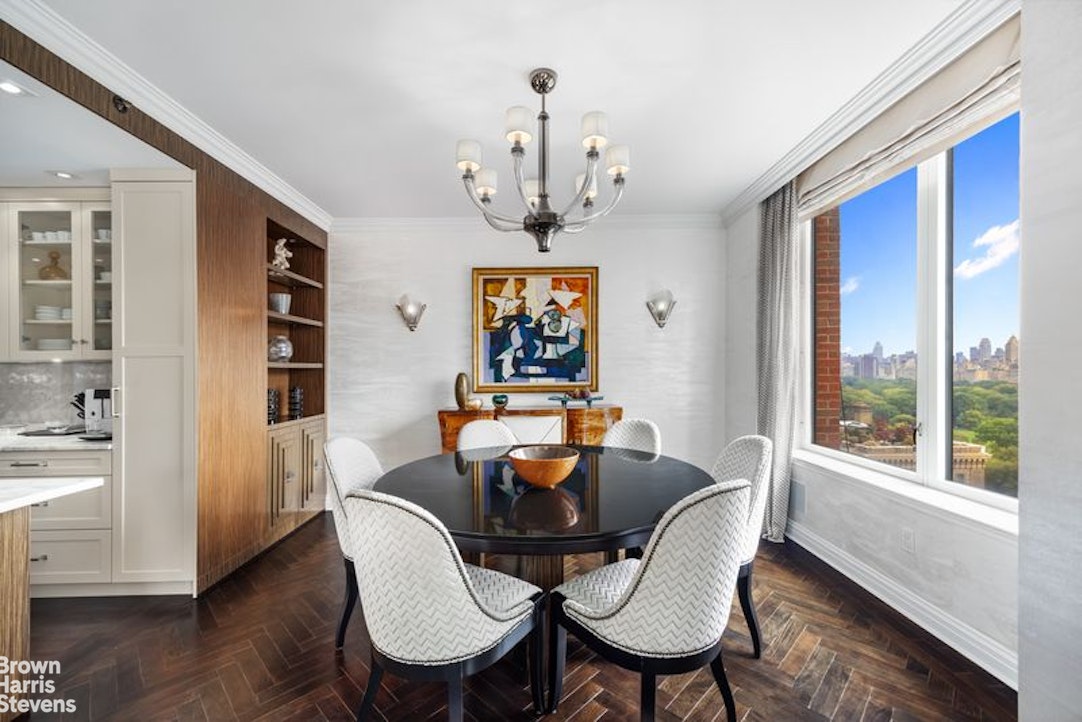 15 West 63rd Street, Unit 20B Manhattan, NY 10023 - Photo 5 of 14 a dining room with furniture a window and wooden floor