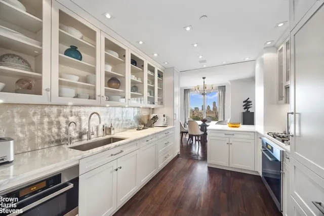 a dining room with furniture a window and wooden floor