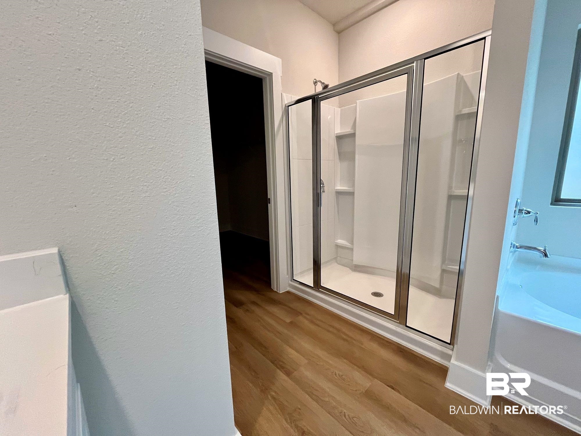 330 Barndling Street Fairhope, AL 36532 - Photo 19 of 31 Bathroom featuring independent shower and bath and wood-type flooring