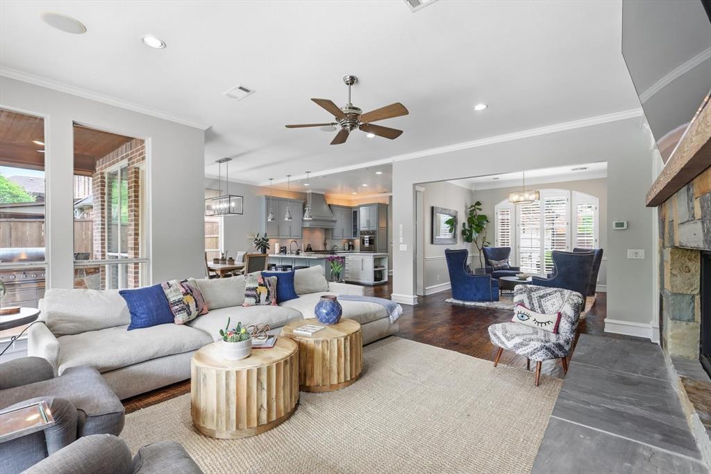 462 Copperstone Trail Coppell, TX 75019 - Photo 2 of 38 a living room with furniture ceiling fan and a large window