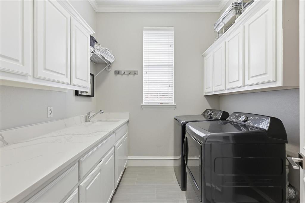462 Copperstone Trail Coppell, TX 75019 - Photo 26 of 38 a utility room with sink dryer and washer