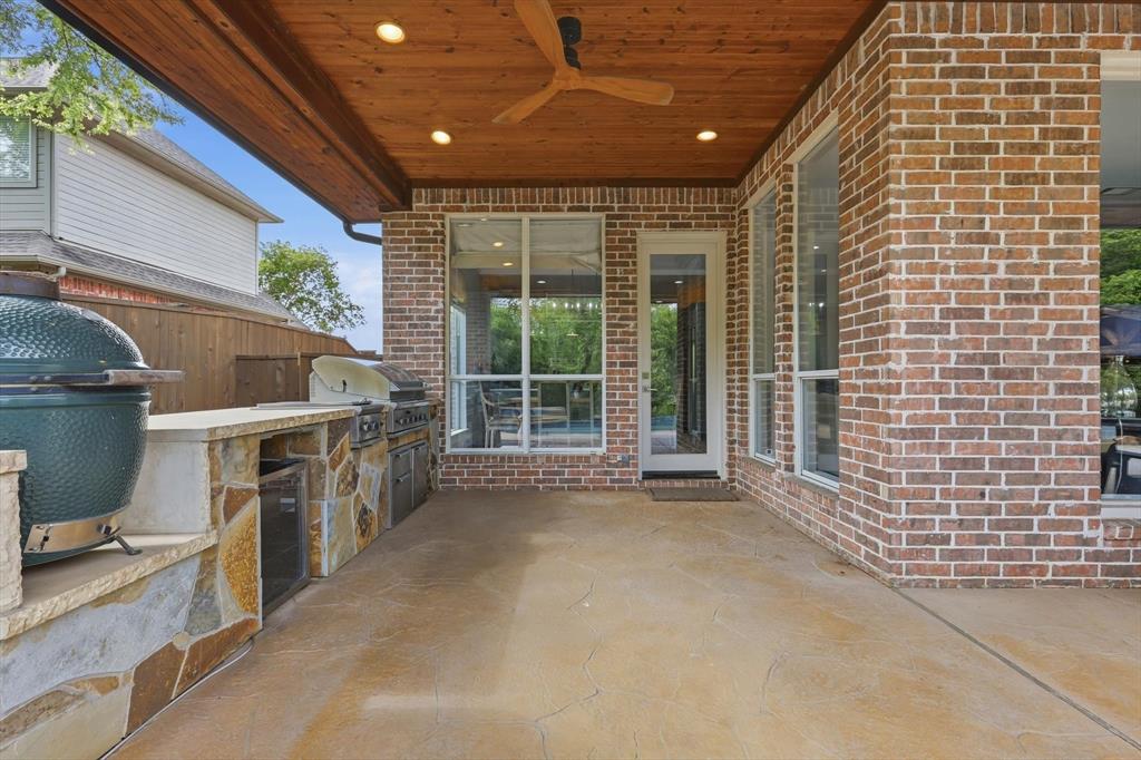 462 Copperstone Trail Coppell, TX 75019 - Photo 29 of 38 a view of a patio with table and chairs