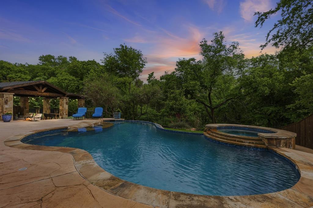 462 Copperstone Trail Coppell, TX 75019 - Photo 33 of 38 a view of a swimming pool with a yard