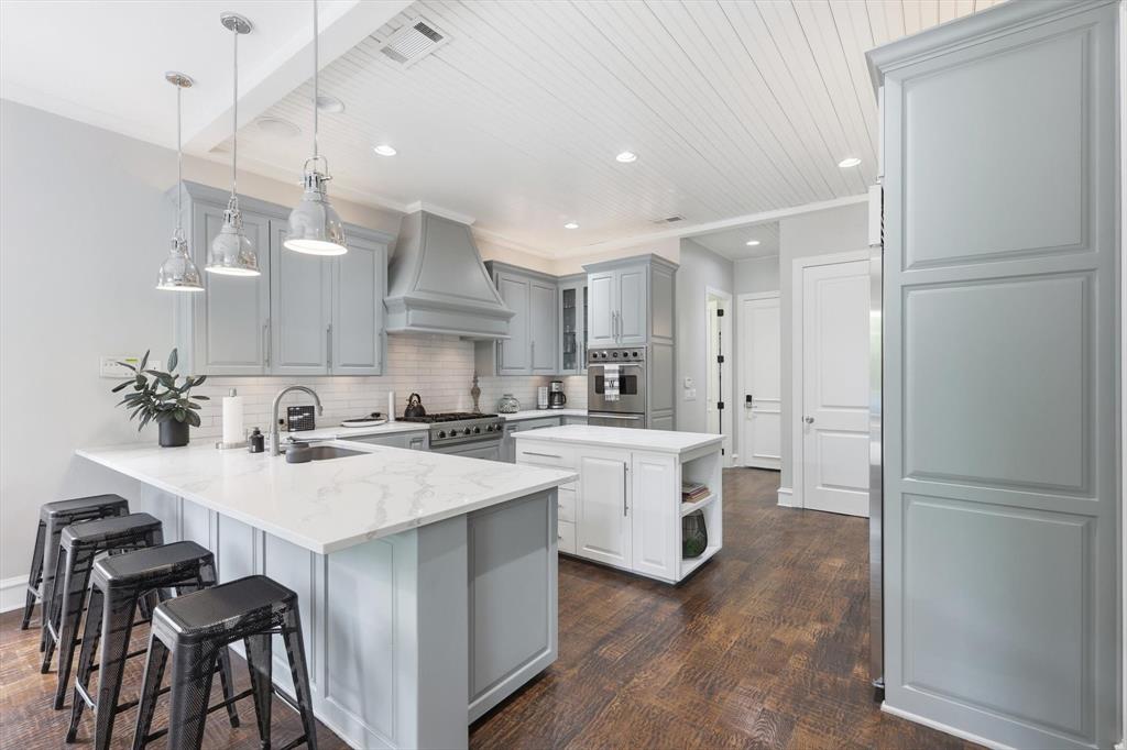 462 Copperstone Trail Coppell, TX 75019 - Photo 7 of 38 a kitchen with white cabinets and white appliances