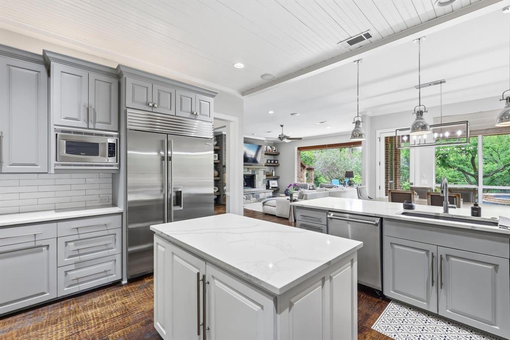 462 Copperstone Trail Coppell, TX 75019 - Photo 8 of 38 a kitchen with a sink stove and cabinets