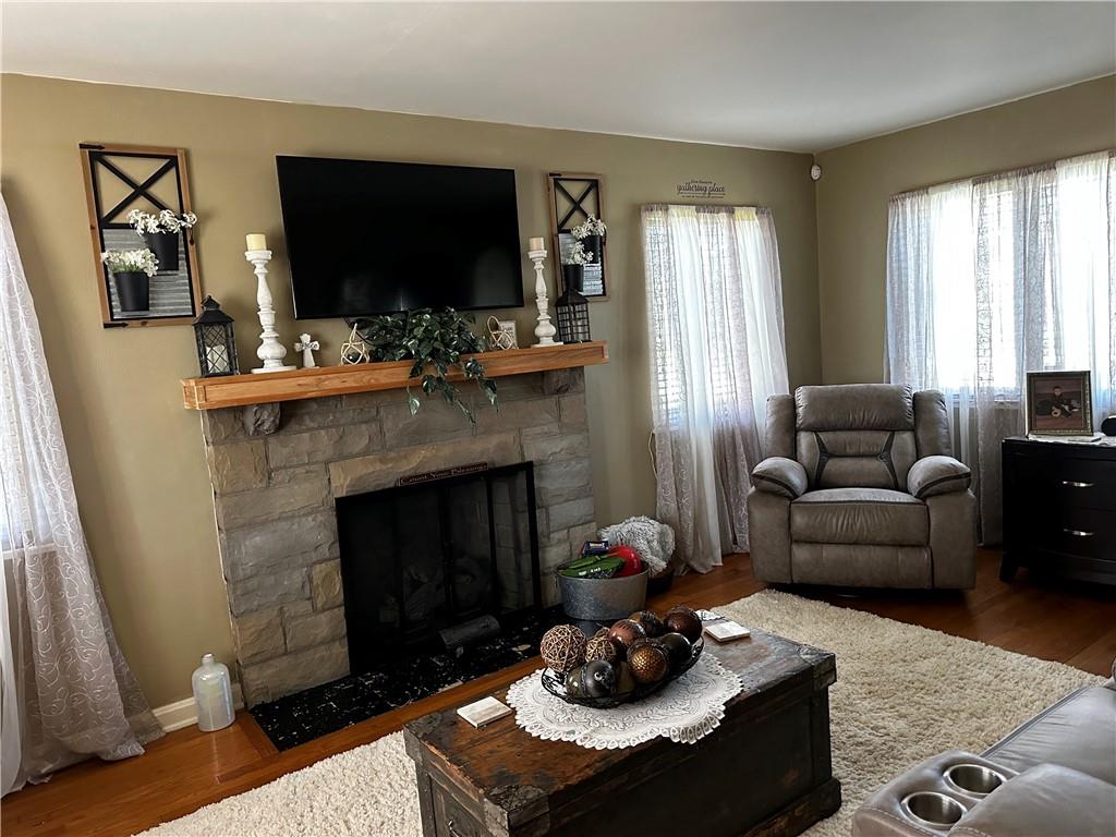 408 Craigdell Road New Kensington, PA 15068 - Photo 2 of 12 a living room with furniture and a fireplace