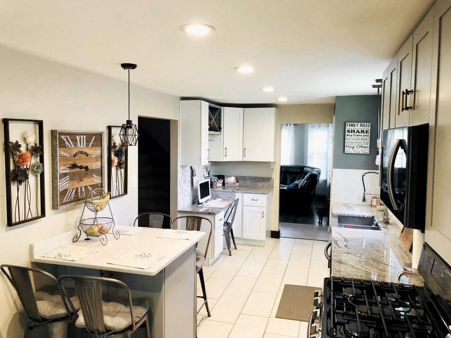 28612 Mall Road Ingleside, IL 60041 - Photo 8 of 12 a kitchen with stainless steel appliances kitchen island granite countertop a refrigerator and a stove top oven