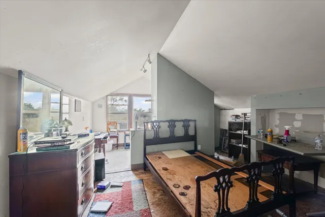 a very nice looking dining room with kitchen island a stove a table and chairs