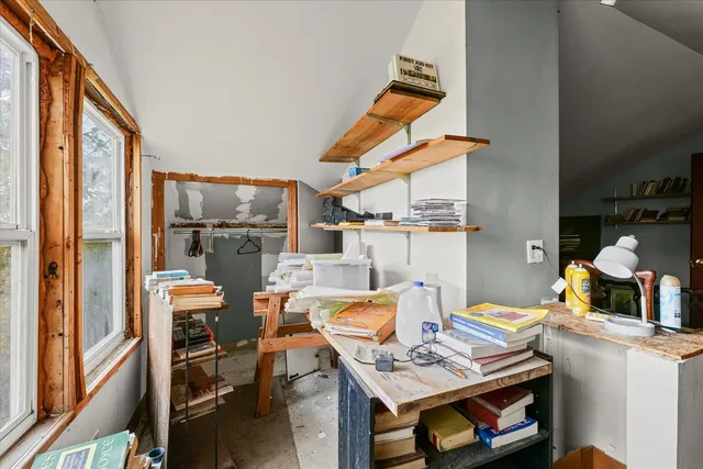 a workspace with furniture and window