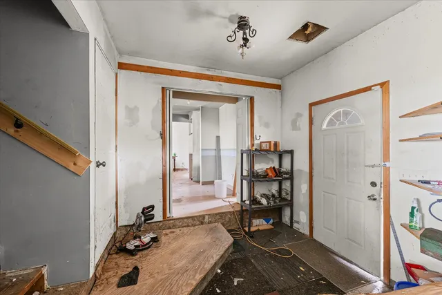 a bedroom with a bed and a mirror