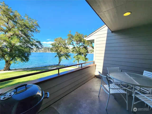 a view of a two chairs in the balcony