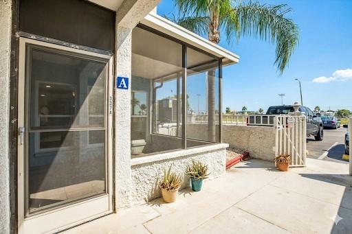 337 Rex Place, Unit A Madeira Beach, FL 33708 - Photo 4 of 48 a view of a patio with a table and chairs