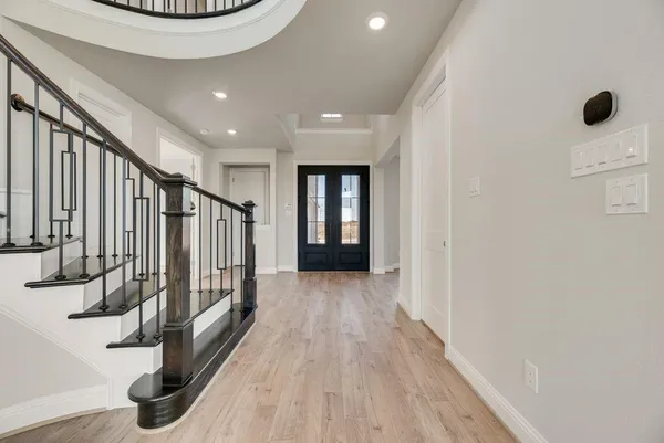 a view of entryway with wooden floor