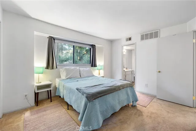 a bathroom with a sink toilet vanity and tub