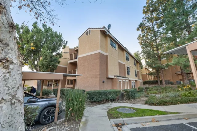 an aerial view of residential building and parking space