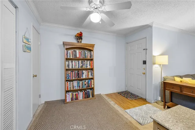 a bedroom with a bed and a bookshelf