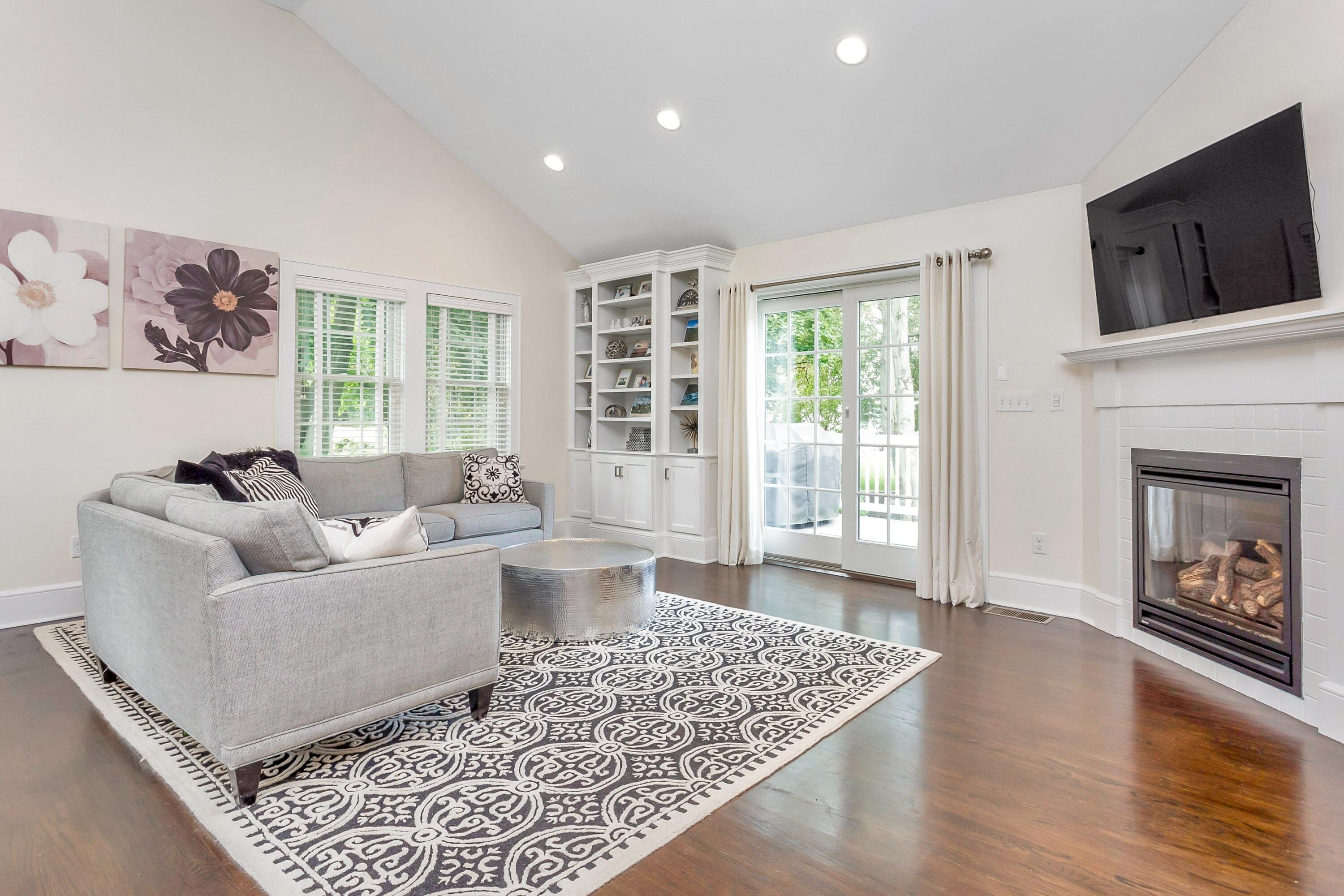 23 Renshaw Road Darien, CT 06820 - Photo 12 of 34 a living room with furniture and a fireplace