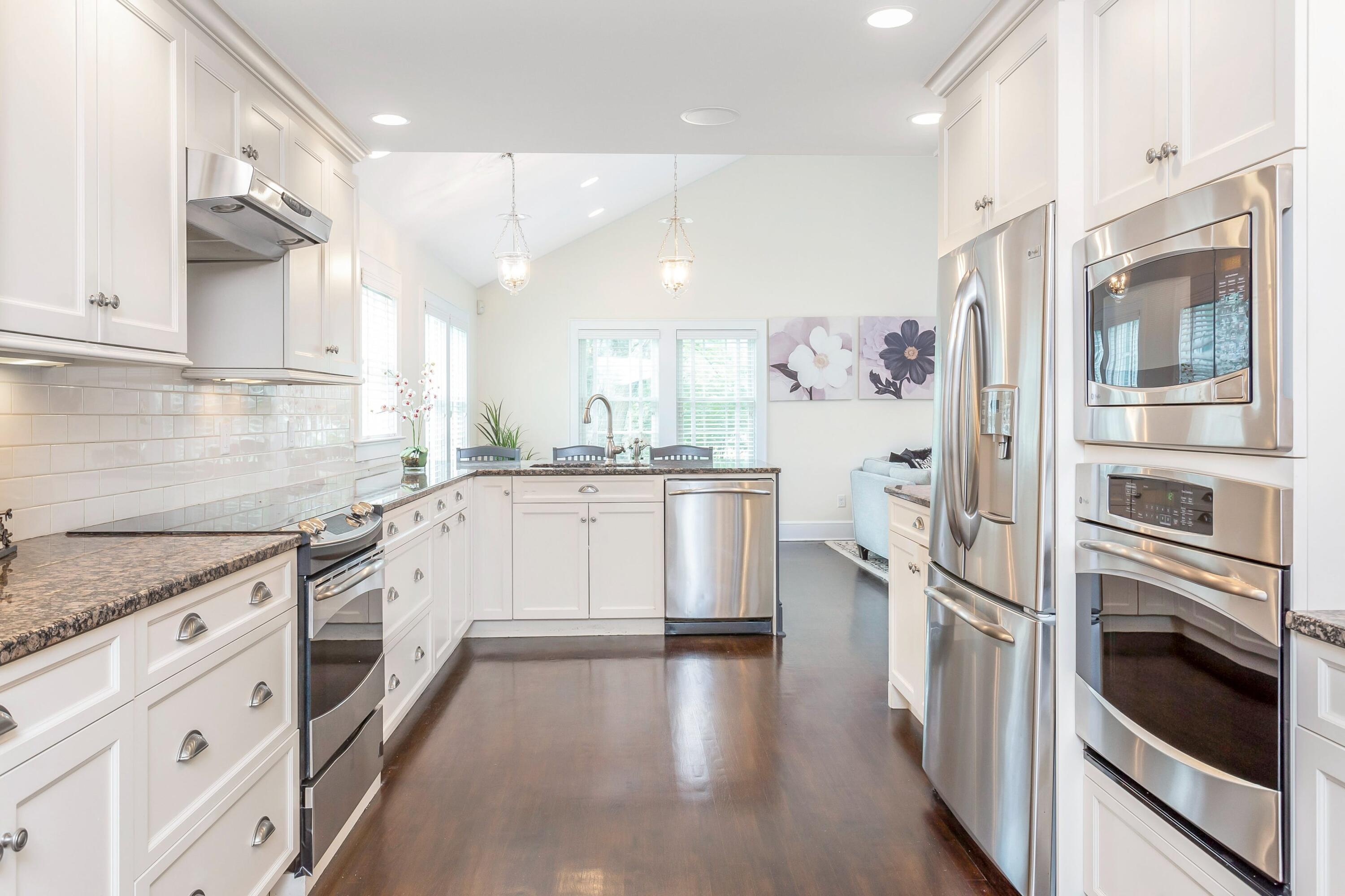 23 Renshaw Road Darien, CT 06820 - Photo 16 of 34 a kitchen with stainless steel appliances white cabinets and a refrigerator
