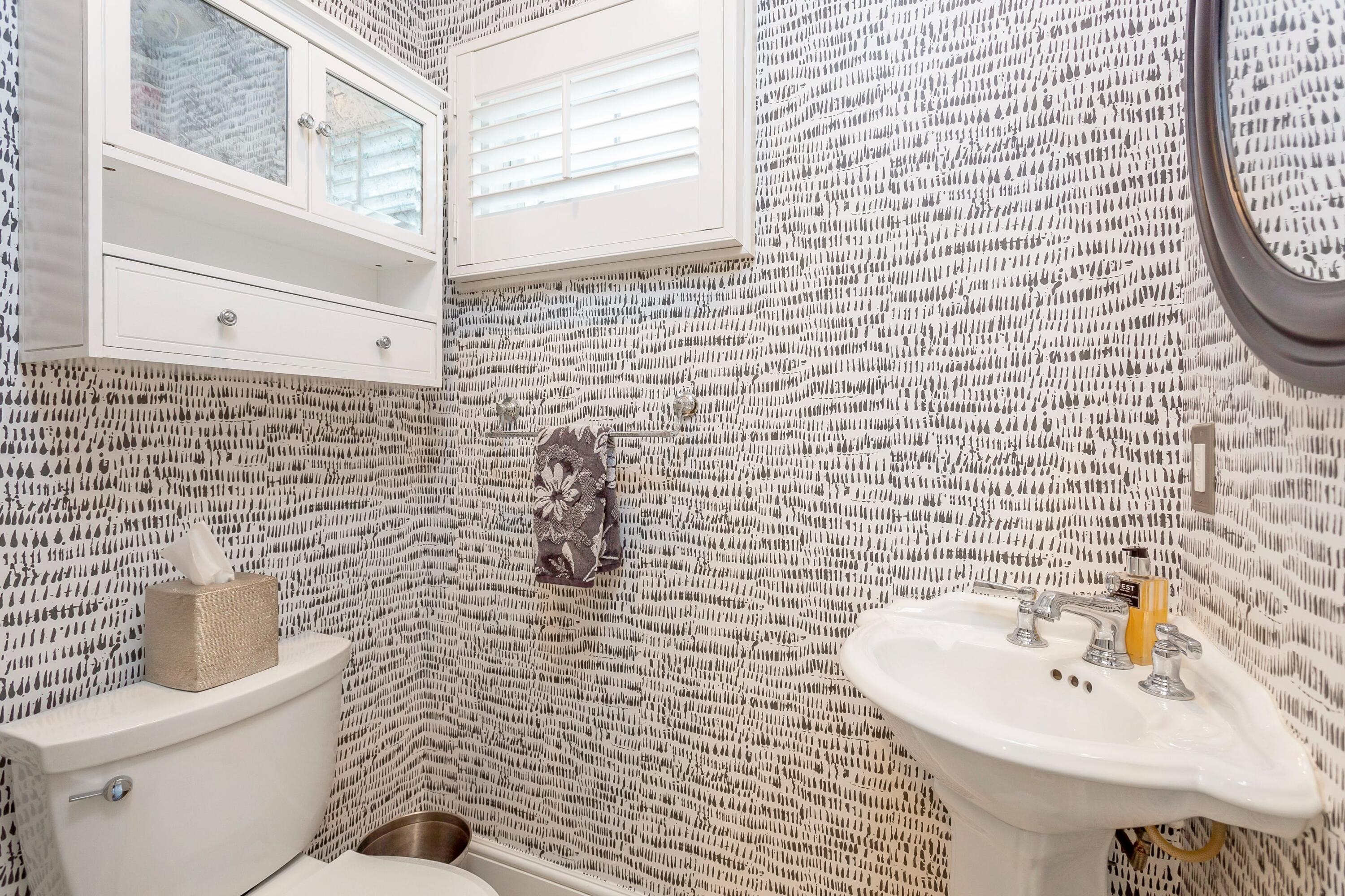23 Renshaw Road Darien, CT 06820 - Photo 20 of 34 a bathroom with a sink a toilet and a mirror