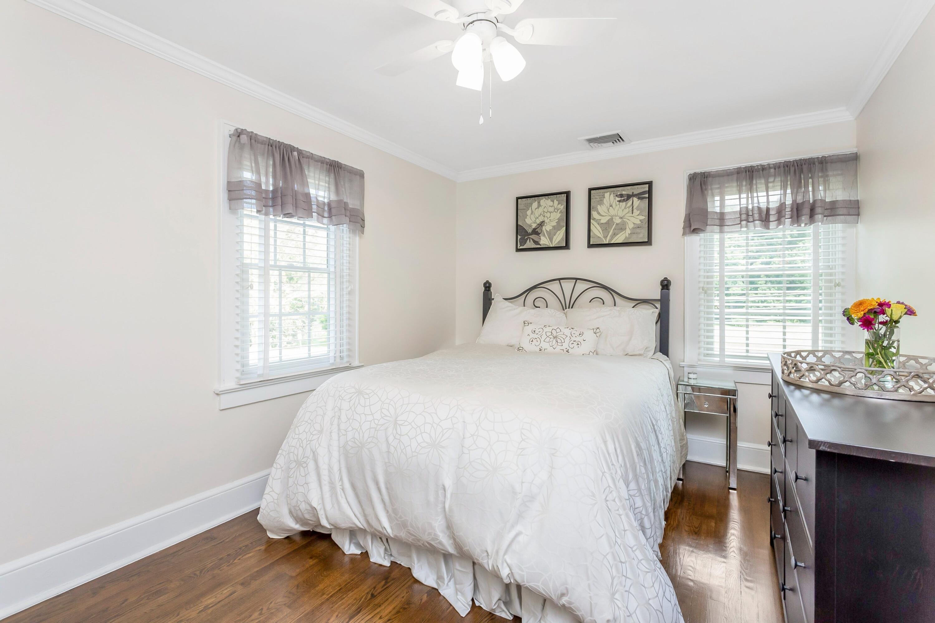 23 Renshaw Road Darien, CT 06820 - Photo 22 of 34 a bedroom with a bed and a window