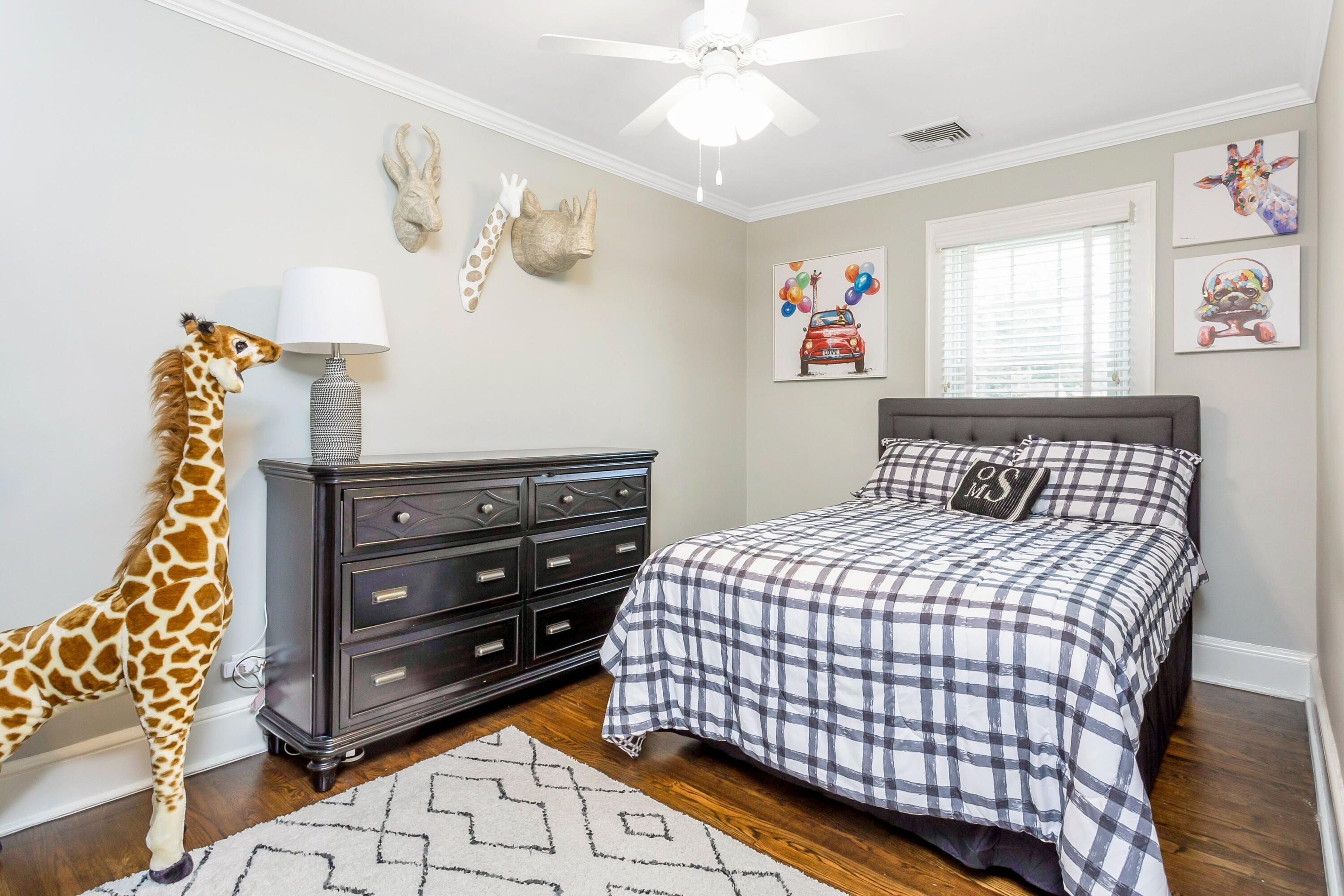 23 Renshaw Road Darien, CT 06820 - Photo 23 of 34 a bedroom with a bed and wooden floor