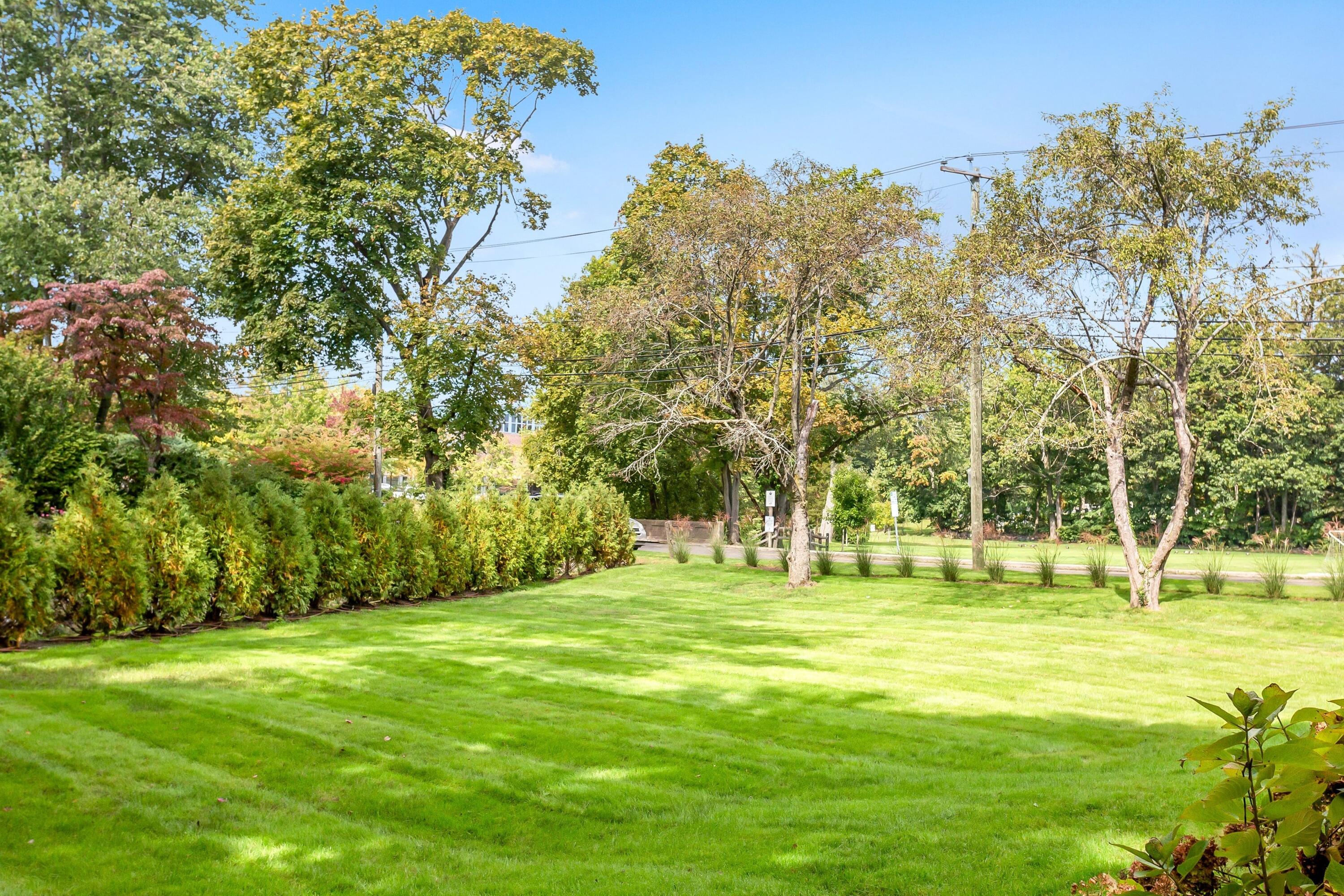 23 Renshaw Road Darien, CT 06820 - Photo 28 of 34 a large building with trees in the background