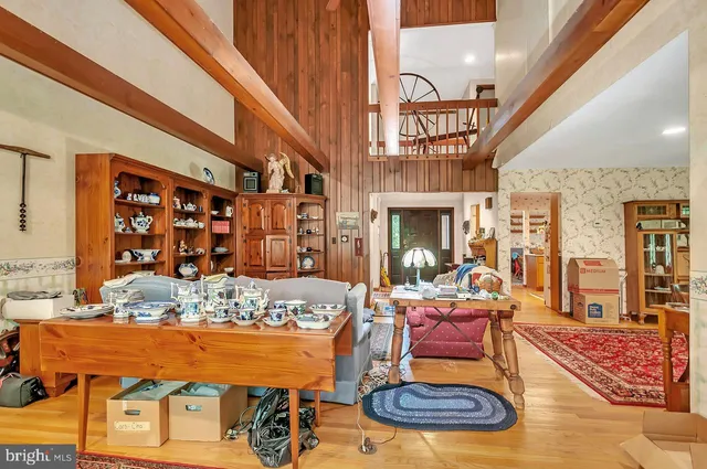 a large kitchen with stainless steel appliances granite countertop a large window and a sink