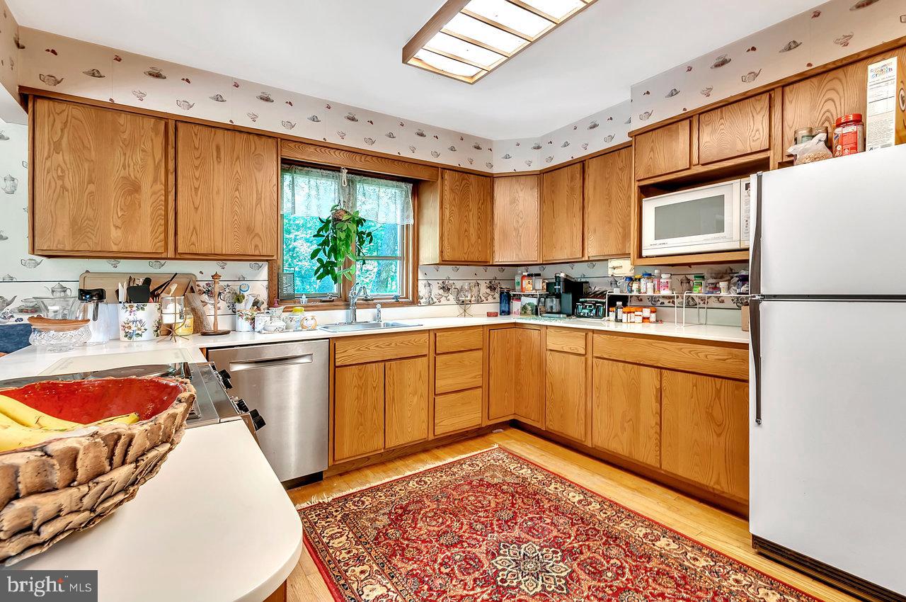 145 White Pine Road Chesterfield, NJ 08515 - Photo 14 of 48 a kitchen with stainless steel appliances granite countertop a sink and cabinets