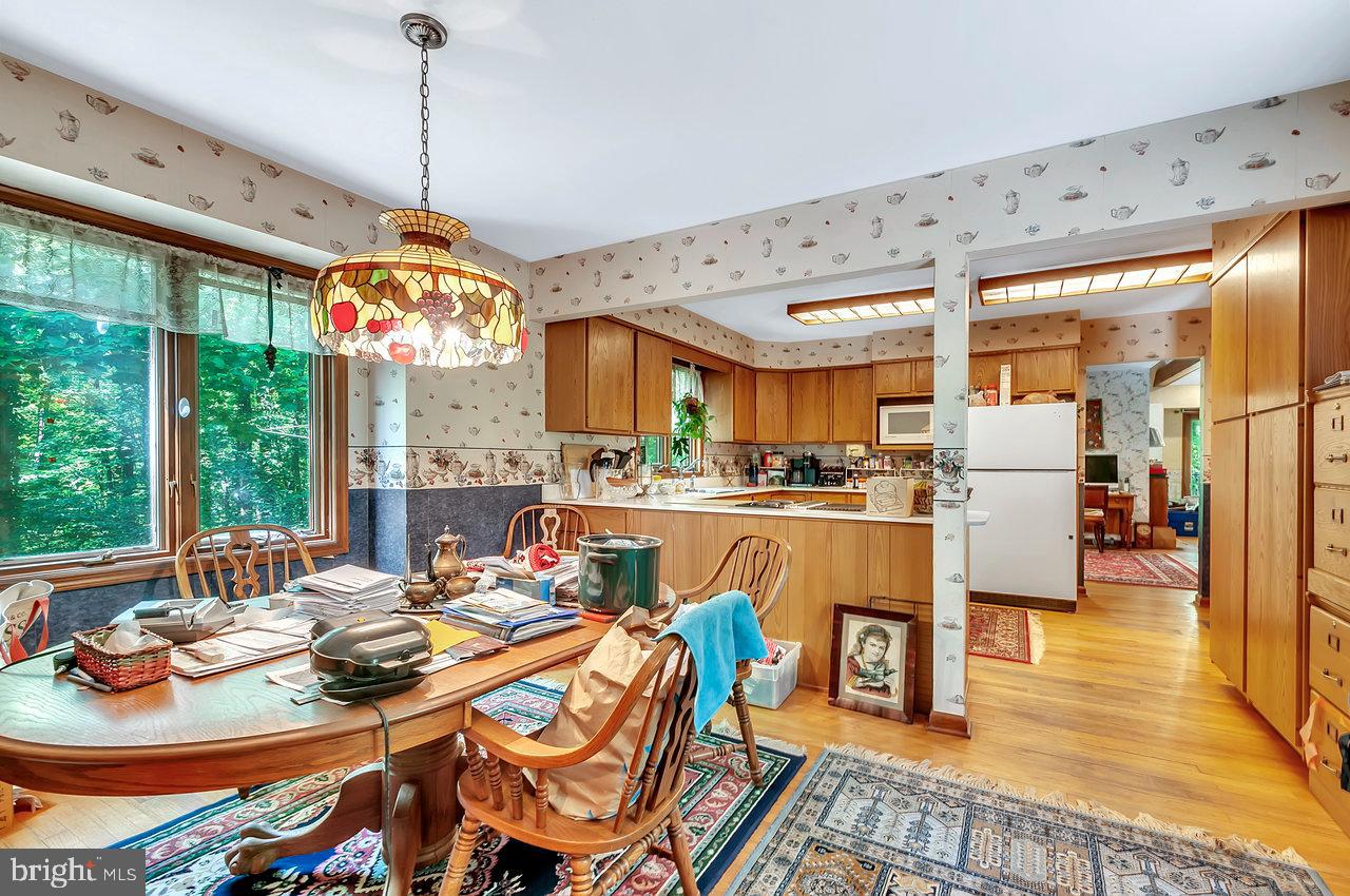 145 White Pine Road Chesterfield, NJ 08515 - Photo 17 of 48 a dining room with furniture a chandelier and wooden floor