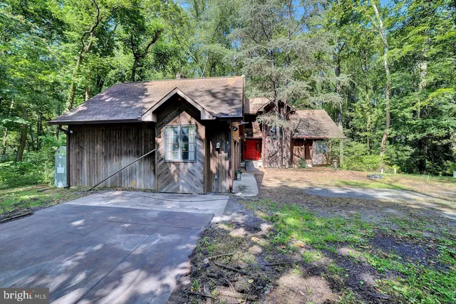 a house with trees in the background