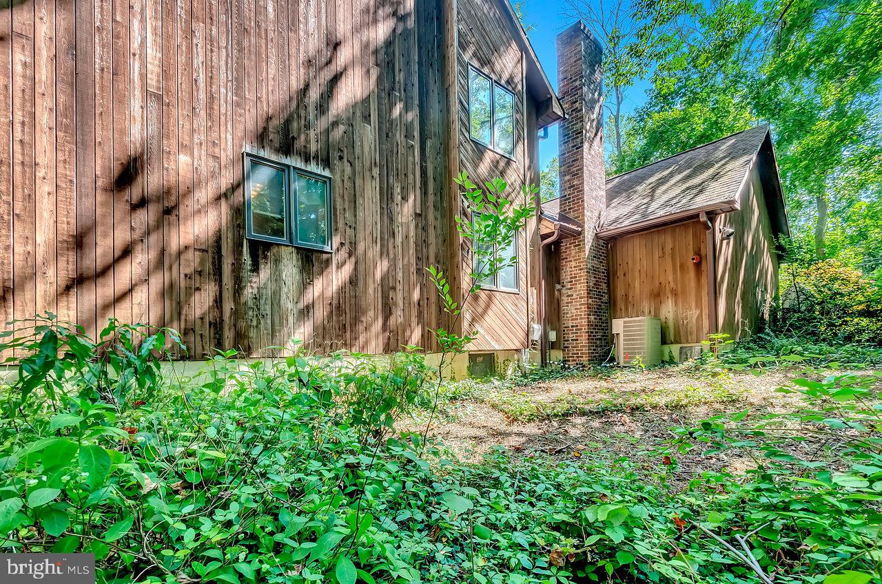 145 White Pine Road Chesterfield, NJ 08515 - Photo 37 of 48 a backyard of a house with lots of green space and wooden fence