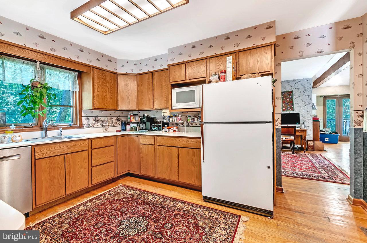 145 White Pine Road Chesterfield, NJ 08515 - Photo 4 of 48 a kitchen with a refrigerator and a sink