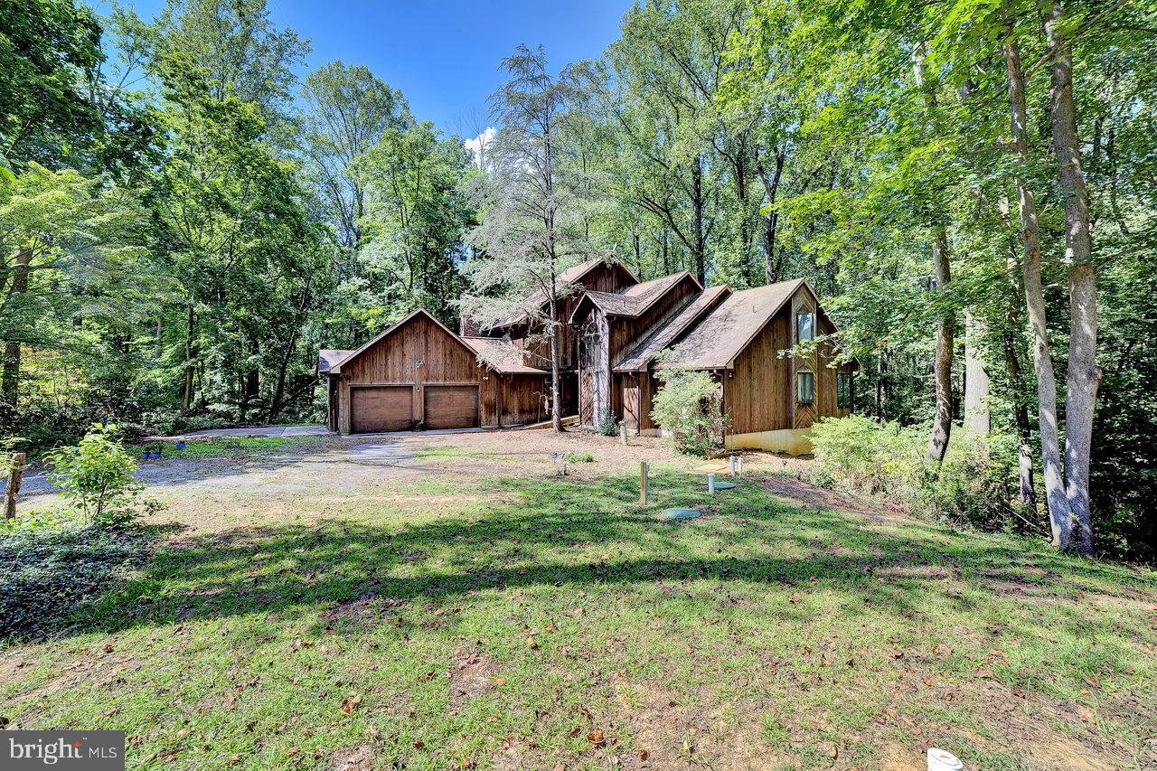 145 White Pine Road Chesterfield, NJ 08515 - Photo 42 of 48 a front view of a house with a yard and trees