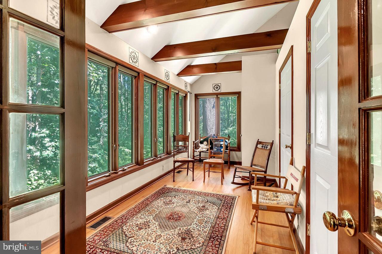 145 White Pine Road Chesterfield, NJ 08515 - Photo 6 of 48 a view of a living room with furniture and floor to ceiling windows